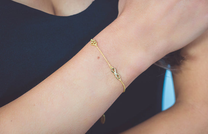 SEVEN NATURAL DIAMOND INFINITY BRACELET GOLD