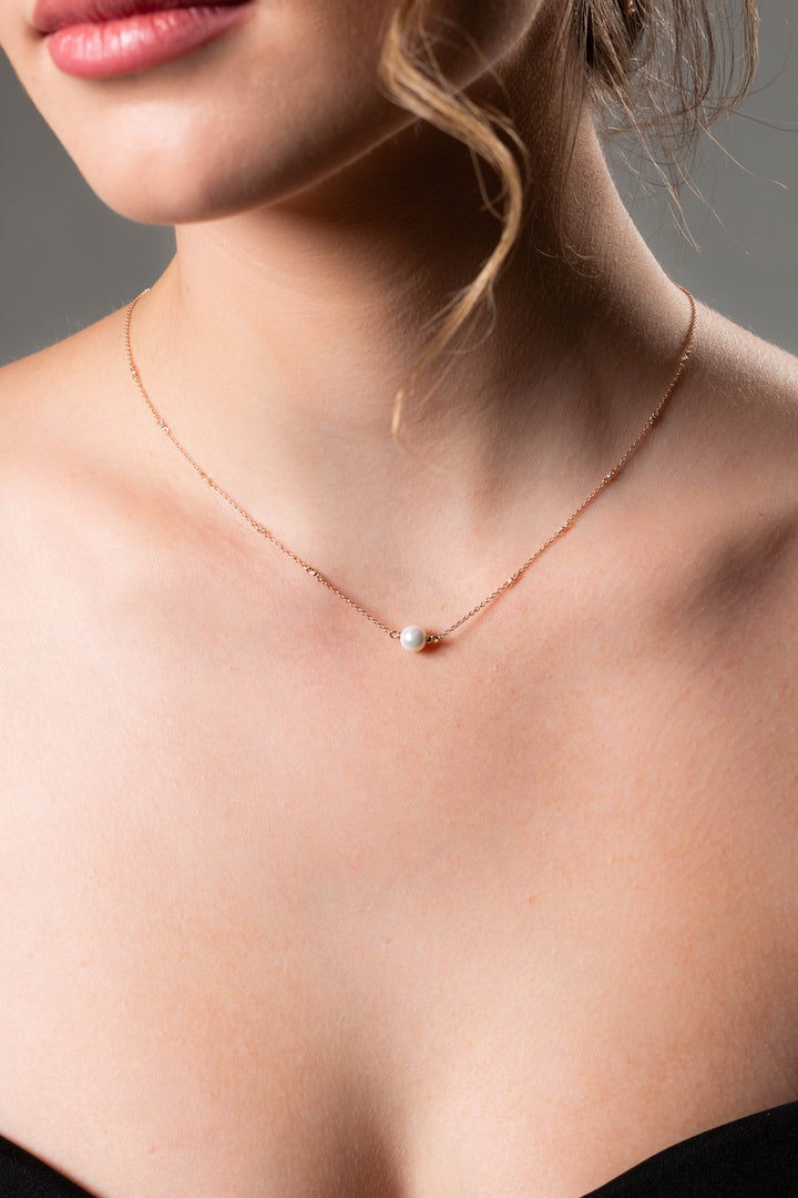 RED CARPET GLOBE NECKLACE ROSE GOLD
